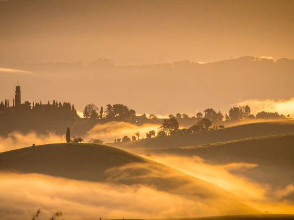 Hills and Mist at Sunrise in Tuscany, Italy